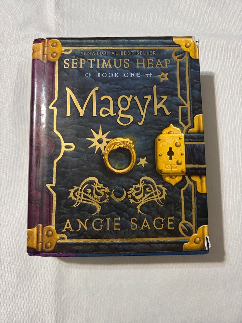 Magyk (Septimus Heap Book One) by Angie Sage - Gold & Dark Teal Hardcover